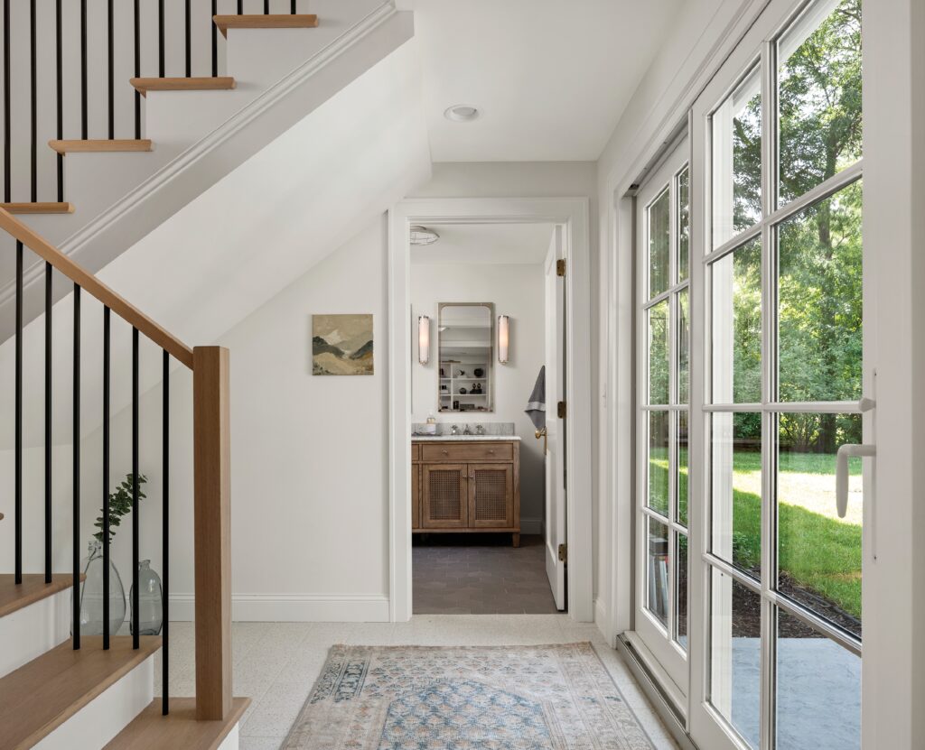 patio doors leading to the backyard of a Michigan home, white and wooden modern interior of the home