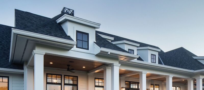 the exterior of a home with windows along the front walls